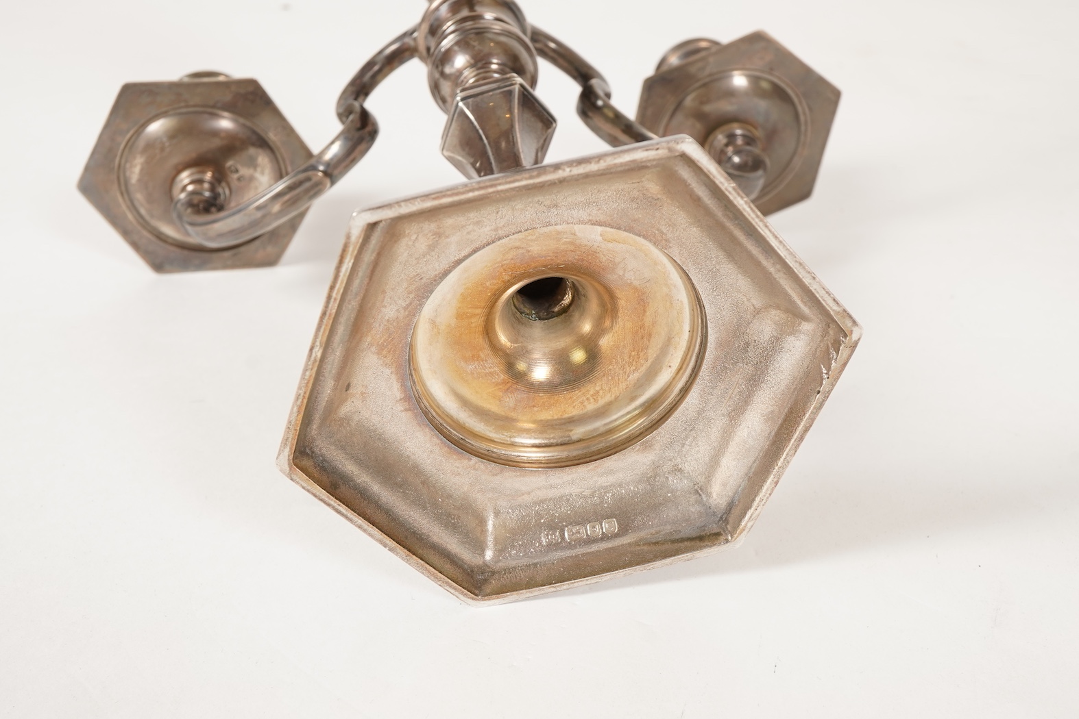 An Elizabeth II silver three branch, three light candelabrum, by William Comyns & Sons Ltd